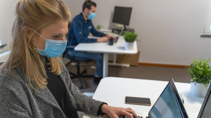 Coworkers with masks